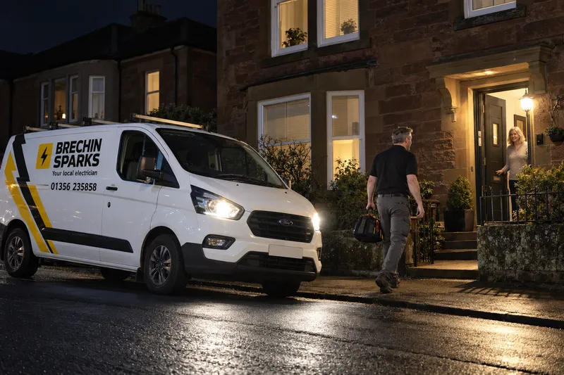 Brechin Sparks van pulling up outside a sandstone house in Brechin at night