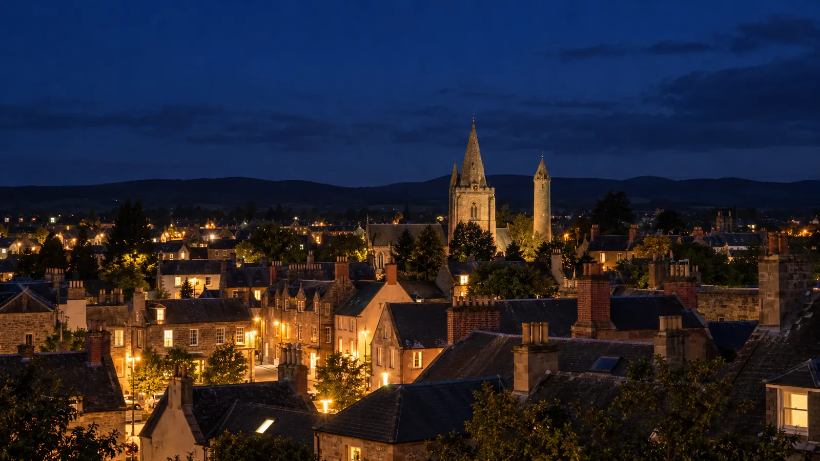 Brechin at night, with lights on across the town's rooftops